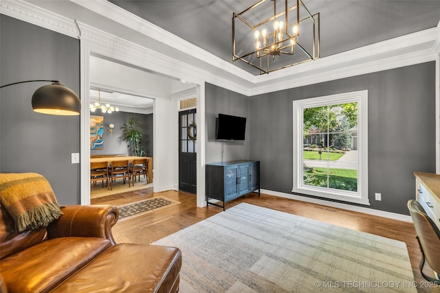 5414 E 109th Pl, Tulsa, OK 74137 - living area with a chandelier, wood finished floors, ornamental molding, and a raised ceiling