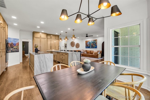5414 E 109th Pl, Tulsa, OK 74137 - dining room with ceiling fan, wood finished floors, recessed lighting, and a chandelier