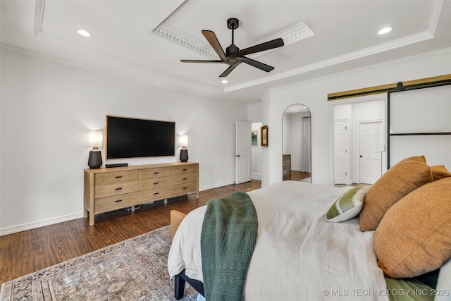 5414 E 109th Pl, Tulsa, OK 74137 - bedroom with a raised ceiling, ornamental molding, wood finished floors, a barn door, and recessed lighting