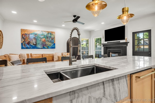 5414 E 109th Pl, Tulsa, OK 74137 - kitchen with open floor plan, a fireplace, dishwasher, a ceiling fan, and light stone countertops