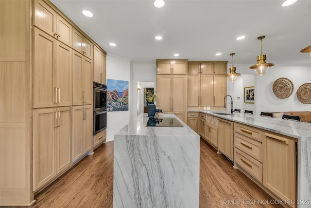5414 E 109th Pl, Tulsa, OK 74137 - kitchen featuring a large island with sink, light brown cabinetry, multiple ovens, light stone counters, and dishwashing machine