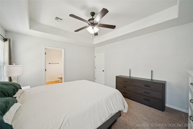 9246 N 143rd E Ave, Owasso, OK 74055 - bedroom featuring a raised ceiling, a ceiling fan, and carpet floors