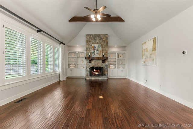 4620 E 108th Pl S, Tulsa, OK 74137 - unfurnished living room with ceiling fan, wood finished floors, a fireplace, built in shelves, and a towering ceiling