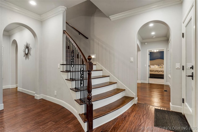 4620 E 108th Pl S, Tulsa, OK 74137 - foyer featuring arched walkways, wood-type flooring, crown molding, stairs, and recessed lighting
