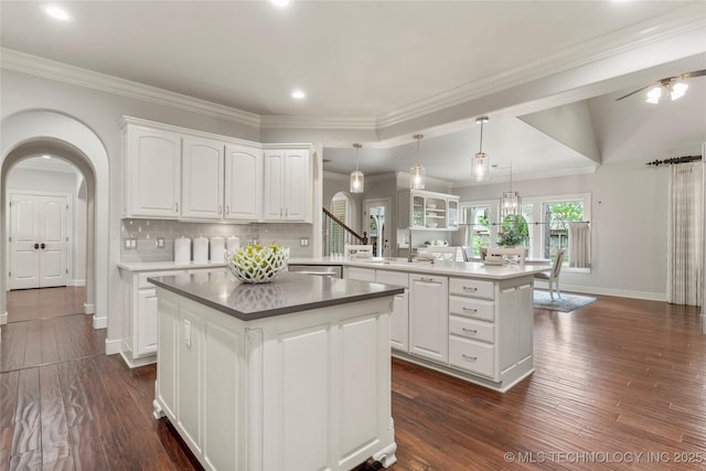 4620 E 108th Pl S, Tulsa, OK 74137 - kitchen with a peninsula, a kitchen island, white cabinets, dark wood-style floors, and recessed lighting