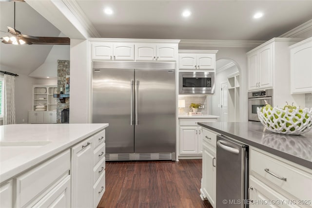 4620 E 108th Pl S, Tulsa, OK 74137 - kitchen with built in appliances, a ceiling fan, recessed lighting, ornamental molding, and white cabinets