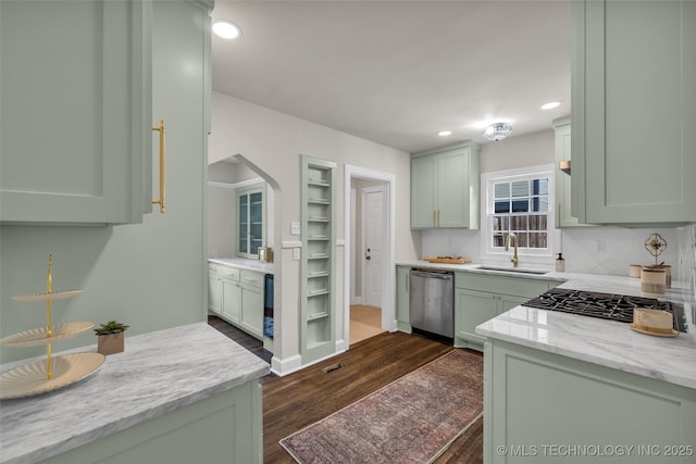 1743 S Florence Pl, Tulsa, OK 74104 - kitchen with dishwasher, green cabinets, dark wood-type flooring, recessed lighting, and arched walkways