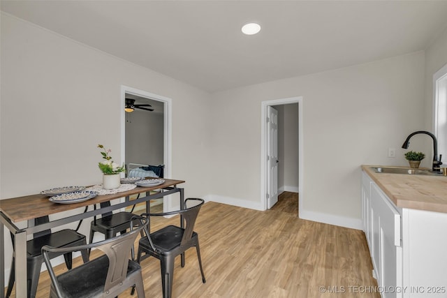 1743 S Florence Pl, Tulsa, OK 74104 - dining room featuring light wood finished floors and a ceiling fan