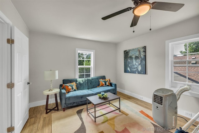 1743 S Florence Pl, Tulsa, OK 74104 - living area with light wood finished floors, plenty of natural light, and ceiling fan