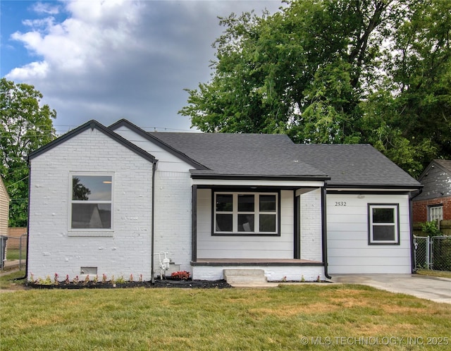 2532 E 4th St, Tulsa, OK 74104 - bungalow featuring a porch, brick siding, and roof with shingles