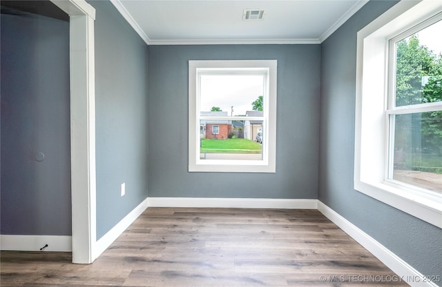 2532 E 4th St, Tulsa, OK 74104 - empty room with crown molding and wood finished floors