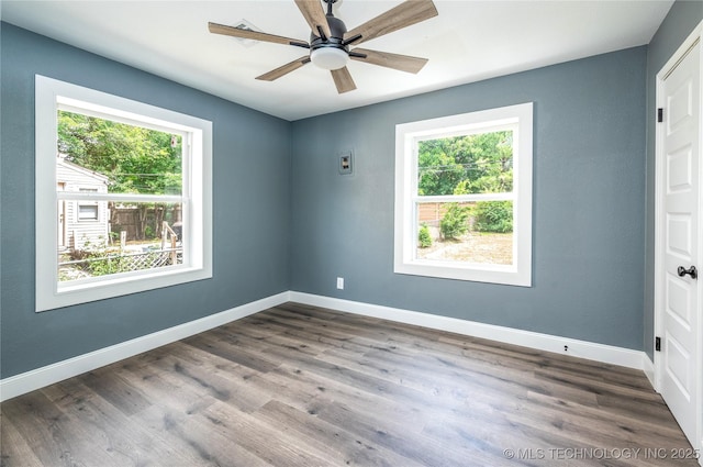 2532 E 4th St, Tulsa, OK 74104 - empty room with plenty of natural light, dark wood-type flooring, and ceiling fan