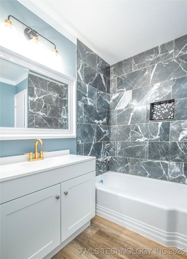 2532 E 4th St, Tulsa, OK 74104 - full bath with vanity, wood finished floors, and shower / washtub combination
