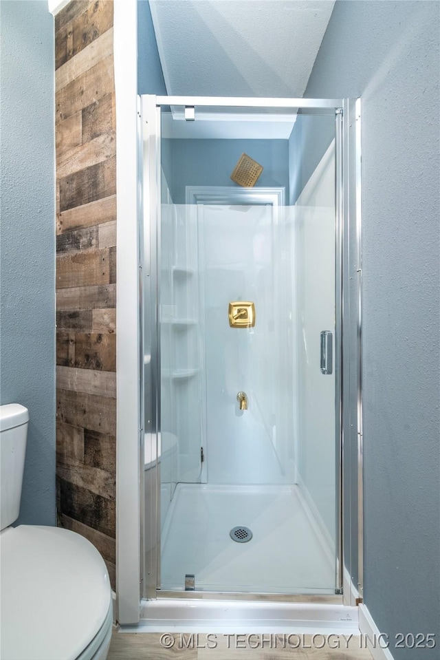 2532 E 4th St, Tulsa, OK 74104 - bathroom featuring a stall shower and a textured wall