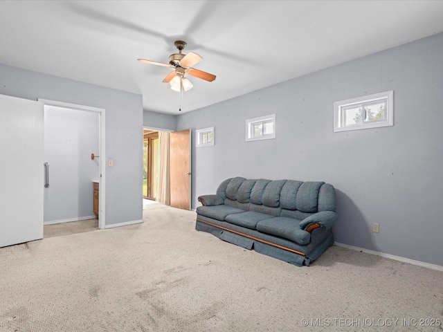 320 E 7th St, Pawhuska, OK 74056 - carpeted living room with a ceiling fan and baseboards