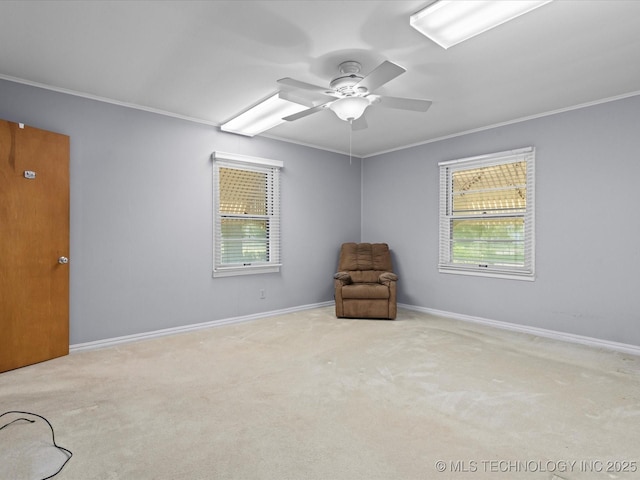 320 E 7th St, Pawhuska, OK 74056 - unfurnished room featuring ornamental molding, plenty of natural light, carpet floors, and a ceiling fan
