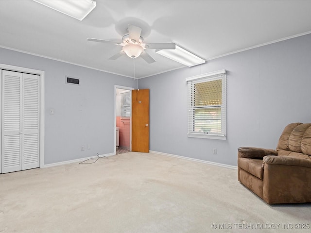 320 E 7th St, Pawhuska, OK 74056 - sitting room with ceiling fan, carpet, and ornamental molding