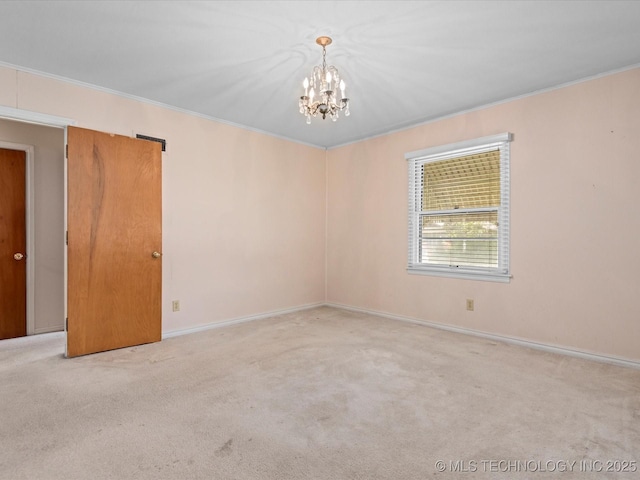 320 E 7th St, Pawhuska, OK 74056 - unfurnished room featuring a chandelier, crown molding, and carpet