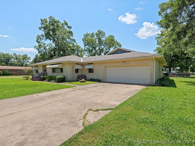 320 E 7th St, Pawhuska, OK 74056 - ranch-style house featuring brick siding, an attached garage, concrete driveway, and a front yard