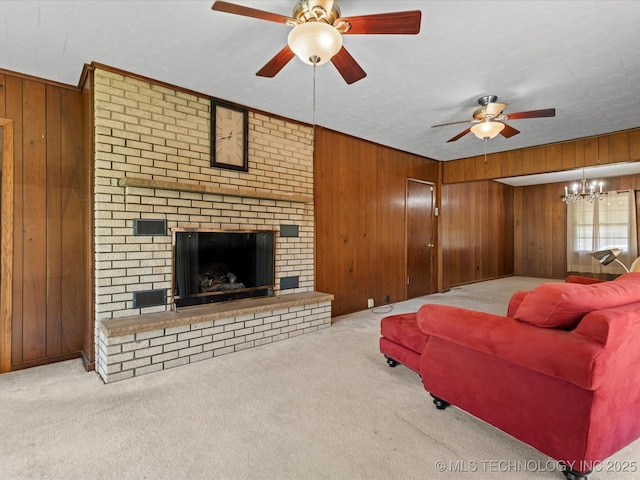 320 E 7th St, Pawhuska, OK 74056 - carpeted living room with wooden walls, ceiling fan, a brick fireplace, and a chandelier