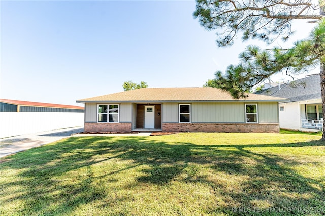 410 Denver St, Pawnee, OK 74058 - single story home with brick siding, a front lawn, and a shingled roof