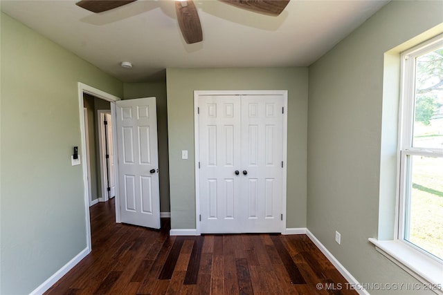 410 Denver St, Pawnee, OK 74058 - unfurnished bedroom with dark wood-style flooring, a closet, and ceiling fan