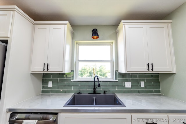 410 Denver St, Pawnee, OK 74058 - kitchen featuring dishwasher, decorative backsplash, white cabinets, and light countertops