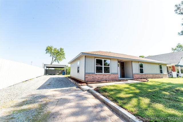 410 Denver St, Pawnee, OK 74058 - ranch-style house featuring brick siding, driveway, a front yard, and roof with shingles