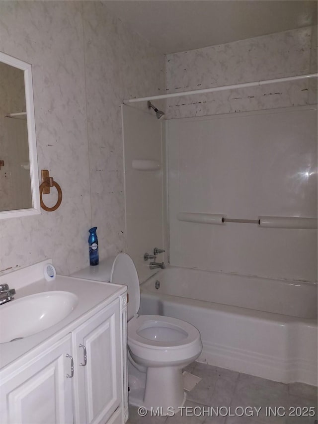 1713 E 10th St, Okmulgee, OK 74447 - full bath featuring vanity, shower / washtub combination, and tile patterned floors