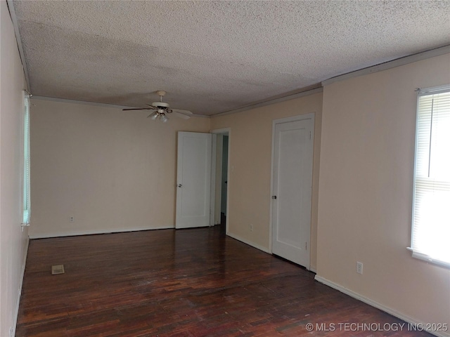 1713 E 10th St, Okmulgee, OK 74447 - spare room featuring a ceiling fan, wood finished floors, and a textured ceiling