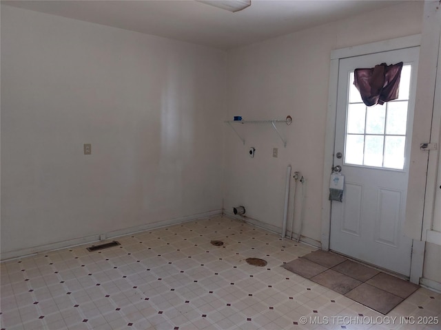 1713 E 10th St, Okmulgee, OK 74447 - laundry room with baseboards