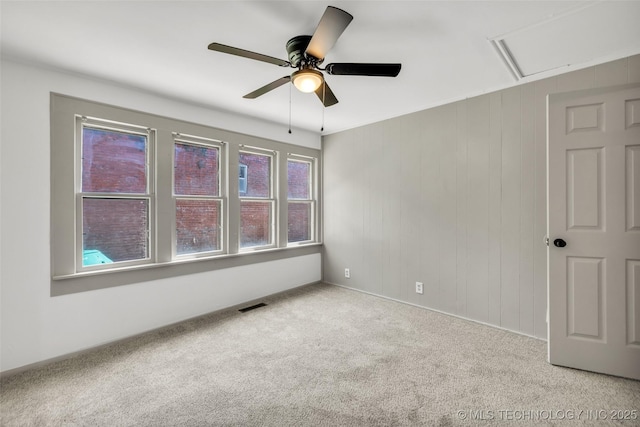 511 S Maple St, Sapulpa, OK 74066 - unfurnished room featuring a ceiling fan, carpet floors, and attic access