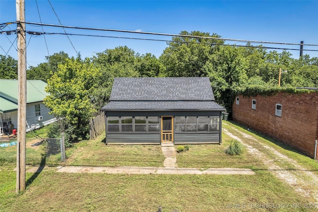 511 S Maple St, Sapulpa, OK 74066 - view of front of house featuring roof with shingles and a sunroom