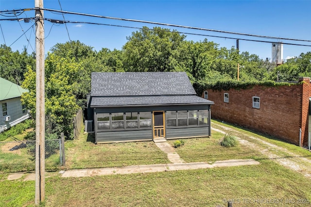 511 S Maple St, Sapulpa, OK 74066 - view of front of house with roof with shingles and a sunroom