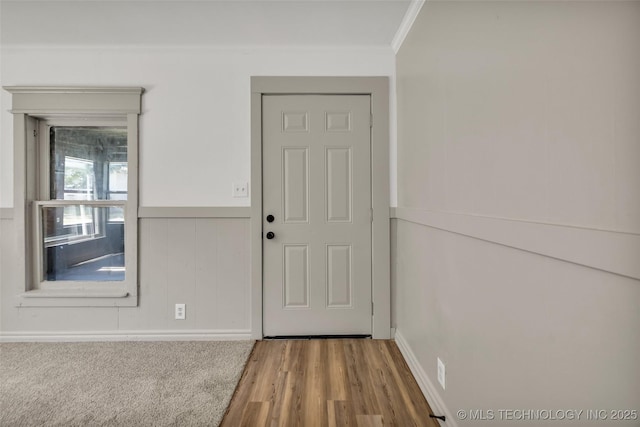511 S Maple St, Sapulpa, OK 74066 - entryway featuring crown molding, wood finished floors, and a wainscoted wall
