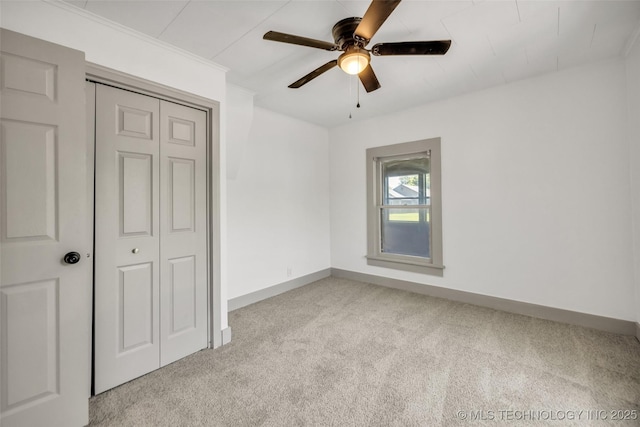 511 S Maple St, Sapulpa, OK 74066 - unfurnished bedroom featuring carpet floors, a closet, and a ceiling fan