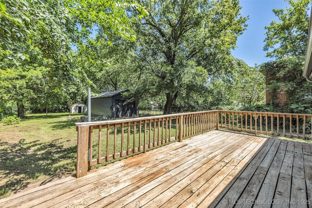 511 S Maple St, Sapulpa, OK 74066 - deck featuring a lawn and a storage unit