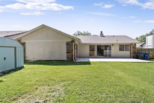 14127 E 24th Pl, Tulsa, OK 74134 - back of house with a patio, a shed, a chimney, and roof with shingles