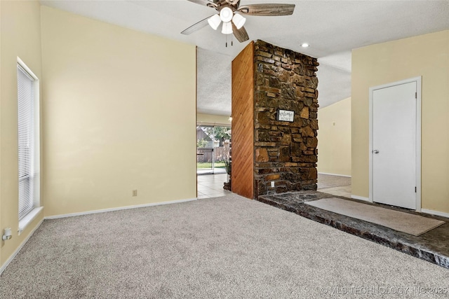 14127 E 24th Pl, Tulsa, OK 74134 - unfurnished living room with carpet floors, ceiling fan, and a textured ceiling