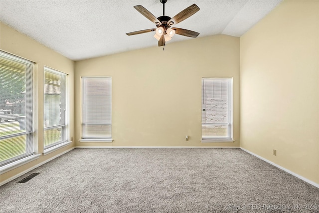 14127 E 24th Pl, Tulsa, OK 74134 - carpeted empty room with a textured ceiling, ceiling fan, healthy amount of natural light, and vaulted ceiling