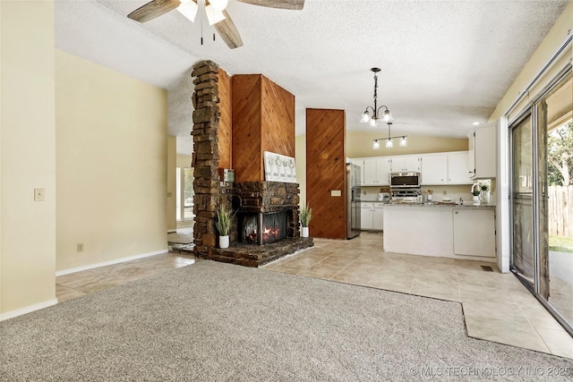 14127 E 24th Pl, Tulsa, OK 74134 - unfurnished living room with lofted ceiling, a ceiling fan, light tile patterned flooring, a chandelier, and a textured ceiling