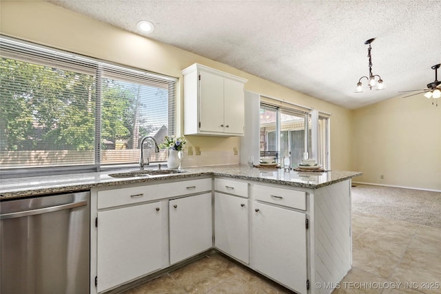 14127 E 24th Pl, Tulsa, OK 74134 - kitchen featuring stainless steel dishwasher, a textured ceiling, a peninsula, white cabinets, and ceiling fan