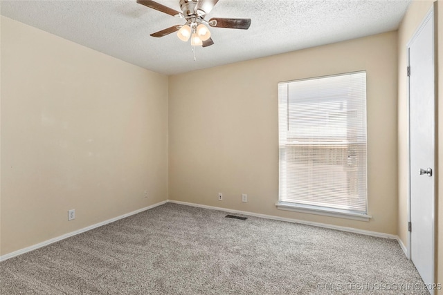 14127 E 24th Pl, Tulsa, OK 74134 - carpeted empty room featuring ceiling fan, healthy amount of natural light, and a textured ceiling