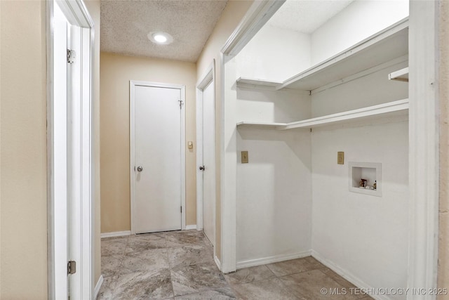 14127 E 24th Pl, Tulsa, OK 74134 - laundry area featuring washer hookup and a textured ceiling