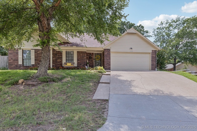 2244 W 45th St, Tulsa, OK 74107 - ranch-style home with concrete driveway, a garage, brick siding, and a front yard
