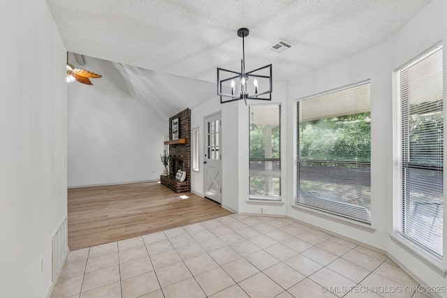 2244 W 45th St, Tulsa, OK 74107 - unfurnished sunroom featuring a chandelier and lofted ceiling