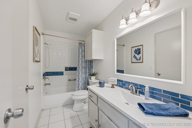 2244 W 45th St, Tulsa, OK 74107 - bathroom with vanity, shower / bath combo, decorative backsplash, tile patterned flooring, and a textured ceiling