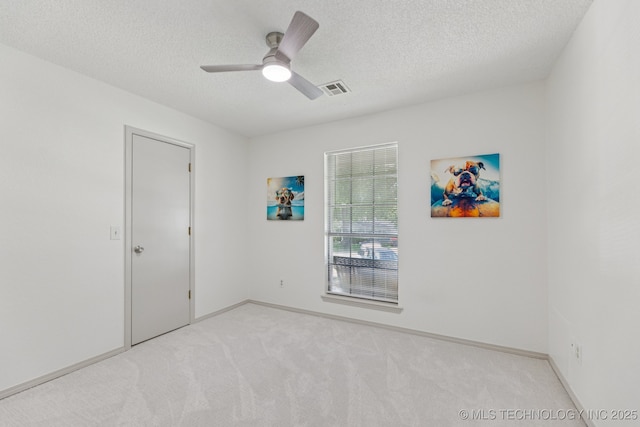 2244 W 45th St, Tulsa, OK 74107 - empty room featuring light colored carpet, a textured ceiling, and a ceiling fan