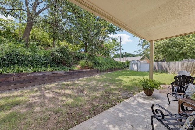 2244 W 45th St, Tulsa, OK 74107 - fenced backyard featuring a shed and a patio area