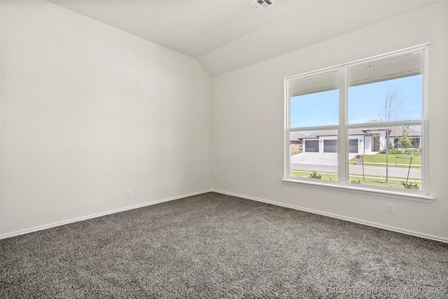 2916 S 8th St, Broken Arrow, OK 74012 - spare room with dark carpet and vaulted ceiling